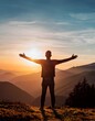 © Thapanon Phoonchai - Silhouette man standing with arms spread stand over the mountains during sunset.
