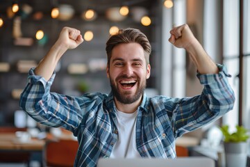 Wall Mural - A man is smiling and raising his hands in the air