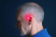 © 1000lnw - Profile of a man with a glowing red light near his ear, illustrating technological advancements in health and wellness.