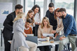 © ivanko80 - Large group of business people engaged in a dynamic meeting