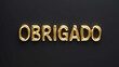 © Erlinda - obrigado word gold metallic shiny lettering on plain black background