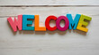 © Erlinda - welcome word colorful wooden letters on plain white background