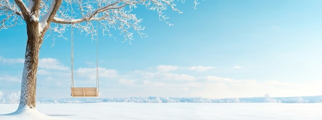 Poster -  A tree with a swing suspended from its branches in a snow-covered field against a backdrop of a blue sky