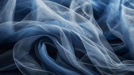 Light airy blue fabric background made of organza or tulle with beautiful folds, fabric texture with waves