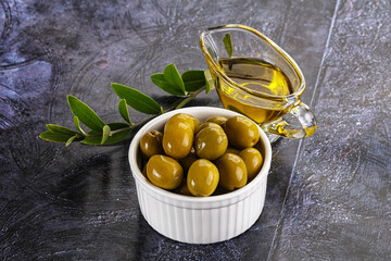 Ripe tasty green olives with branch