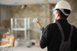 © Antonioguillem - Construction worker holding sledgehammer reforming house