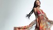 © Denisa - A graceful Asian woman in a colorful bohemian dress strikes a pose, highlighting her unique style and the flowing fabric's movement
