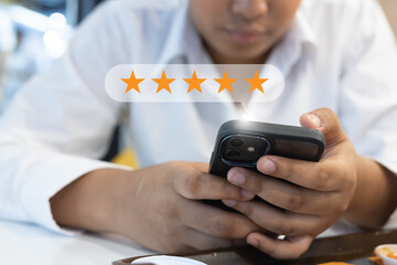 Star icon satisfaction survey, businesswoman finger to smartphone with five star icons, ranking of business. feedback, rating, survey, positive.