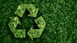 © angel_nt - A vibrant recycling symbol crafted from various shades of green leaves rests atop a rich, leafy background, highlighting themes of sustainability and ecological preservation in nature