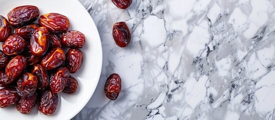 dates on a small plate on a marble background ample copyspace