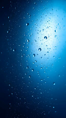 Canvas Print - Water droplets on a blue background with a soft glow.