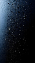 Wall Mural - Water droplets on black surface.