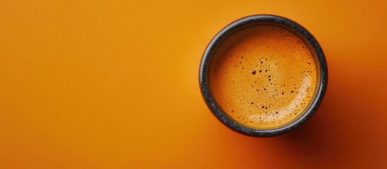 Aufkleber - Ceramic cup filled with hot aromatic coffee on a colored background top view. with copy space image. Place for adding text or design
