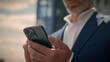© Yuliia - Close up senior business man pensive think problem solution looking at mobile phone in city thoughtful businessman mature entrepreneur elderly employer thinking idea browsing smartphone chat outdoors