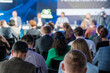 © Anton Gvozdikov - Attendees focusing on speakers during a business conference in a modern setting. Ideal for promoting corporate events and seminars.