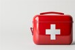 © HendraGalus - 3D rendered red emergency first aid box with white cross symbol, on clean white background. Medical safety equipment concept