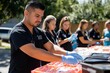 © PremiumPhoto - A group of volunteers providing free health screenings in a community event, emphasizing the importance of accessible healthcare services for all.