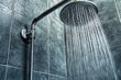 © Jean Isard - Cabin shower with cascading water in a rustic setting