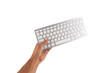 © TropicalNinjaStudio - Hand holding a white keyboard isolated cutout no background