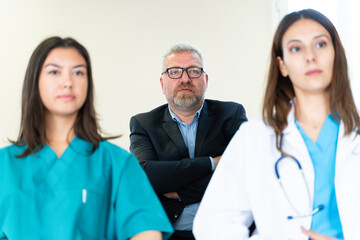 Wall Mural - Group of Medical Team and Business People Meeting in Hospital and Office Conference Room