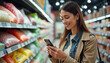 © Ali Hamza Tullah - Happy woman using reminder on smart phone while shopping in supermarket.