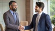 © NHA Studio - Handshake Between Indian Business Partners in Boardroom - Two Indian business partners shaking hands in a formal boardroom setting.