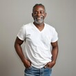 © zz - Portrait of a Smiling Middle-Aged Black Man Wearing a White T-Shirt and Jeans
