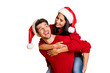 © deagreez - Portrait of cheerful man hug his wife piggyback wear red pullover isolated over yellow background
