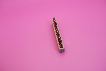 a set of screwdriver bits isolated on purple background