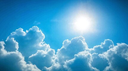 Bright sun shining through fluffy clouds on a clear blue sky