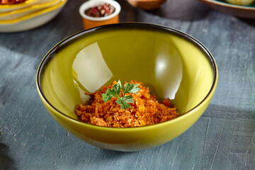 Sticker - Mexican Corn Rice Dish in Green Bowl on Rustic Wooden Table