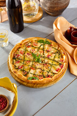 Sticker - Delicious Chicken Pesto Pizza on Rustic Wooden Table - Perfect Restaurant or Menu Image