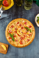 Sticker - Salmon and Tomato Pizza on Wooden Board with Lemon Wedge and Basil Garnish