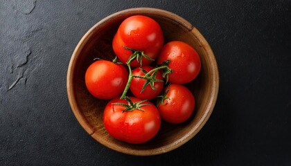 Poster - Tomato in a bowl on a black background