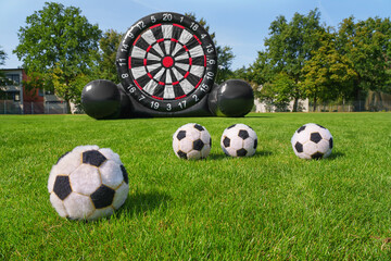 Wall Mural - textured soccer game field with with a large target and a lot of soccer balls.