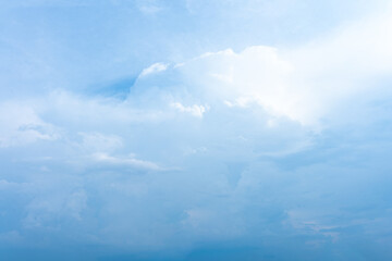 Bright blue sky with fluffy white clouds on a clear summer day