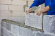 © NVB Stocker - Close up hand construction mason worker bricklayer Engineering people, man construction worker and architecture bricklayers working in work at house construction site. Caucasian men