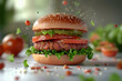 © Emily88 - A delicious cheeseburger featuring a grilled patty, fresh lettuce, sliced tomato, and mayonnaise on a lightly toasted sesame seed bun hamburger.