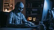 © Nastya - a mummy working at a computer in a dimly lit room, with glowing jack-o'-lanterns in the background