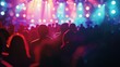 © Sodapeaw - A crowd of people enjoying a vibrant concert with colorful stage lights and energetic atmosphere.