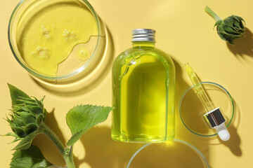 Sticker - Petri dishes with cosmetic product, bottle, pipette and sunflowers on yellow background, flat lay