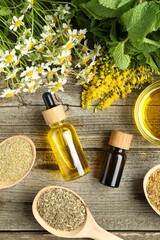 Wall Mural - Tinctures and medicinal herbs on wooden table, flat lay