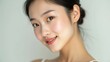 © DAIN - portrait, young woman, smiling, natural beauty, close-up, gentle expression, happiness, serene, soft lighting, skin care, fresh, minimal makeup, beauty, lifestyle, femininity, calm, elegance, simplici
