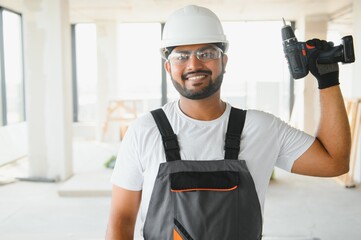 moving, repair and people concept. happy smiling indian worker