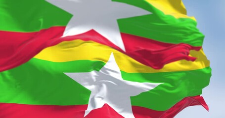 Wall Mural - Close-up of two Myanmar national flags fluttering in the wind