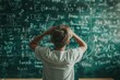 © volga - Overwhelmed student in front of complex math problems on chalkboard