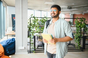 Wall Mural - Happy indian male student at the university