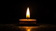 A single candle, glowing brightly against the darkness of night, symbolizes hope and light in times of melancholy. 