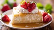 © fivan - A traditional Mexican dessert, tres leches cake, soaked in three types of milk, topped with whipped cream and strawberries