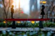 © Vera - seesaw balancing with a man and a woman on each end, representing equal gender parity in the workplace.
